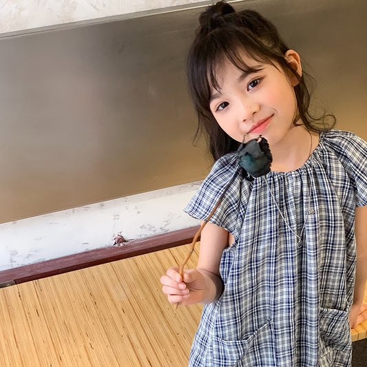 kid girl wearing blue checked dress