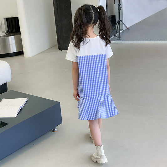 kid girl in a white and blue checkered dress