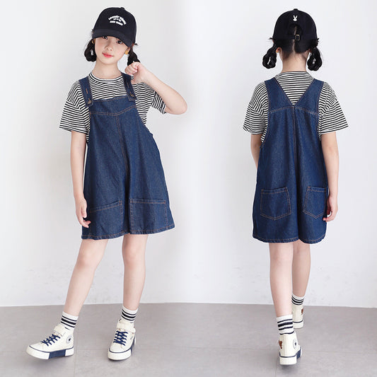 kid girl in denim jumper and striped shirt