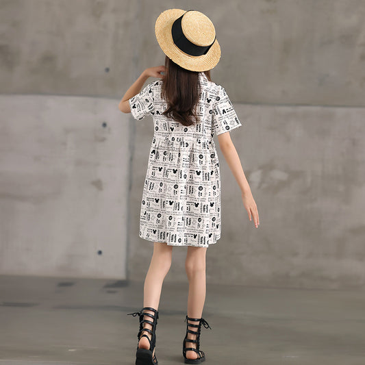 kid girl wearing a one piece white printed dress