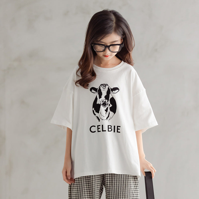 kid girl in oversized graphic t-shirt with checkered pant