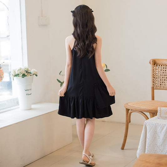 child in a sleeveless black dress